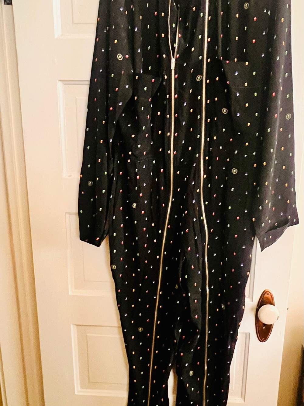 Black multicolored polkadot, double zip jumpsuit. Nehru collar button detail.
